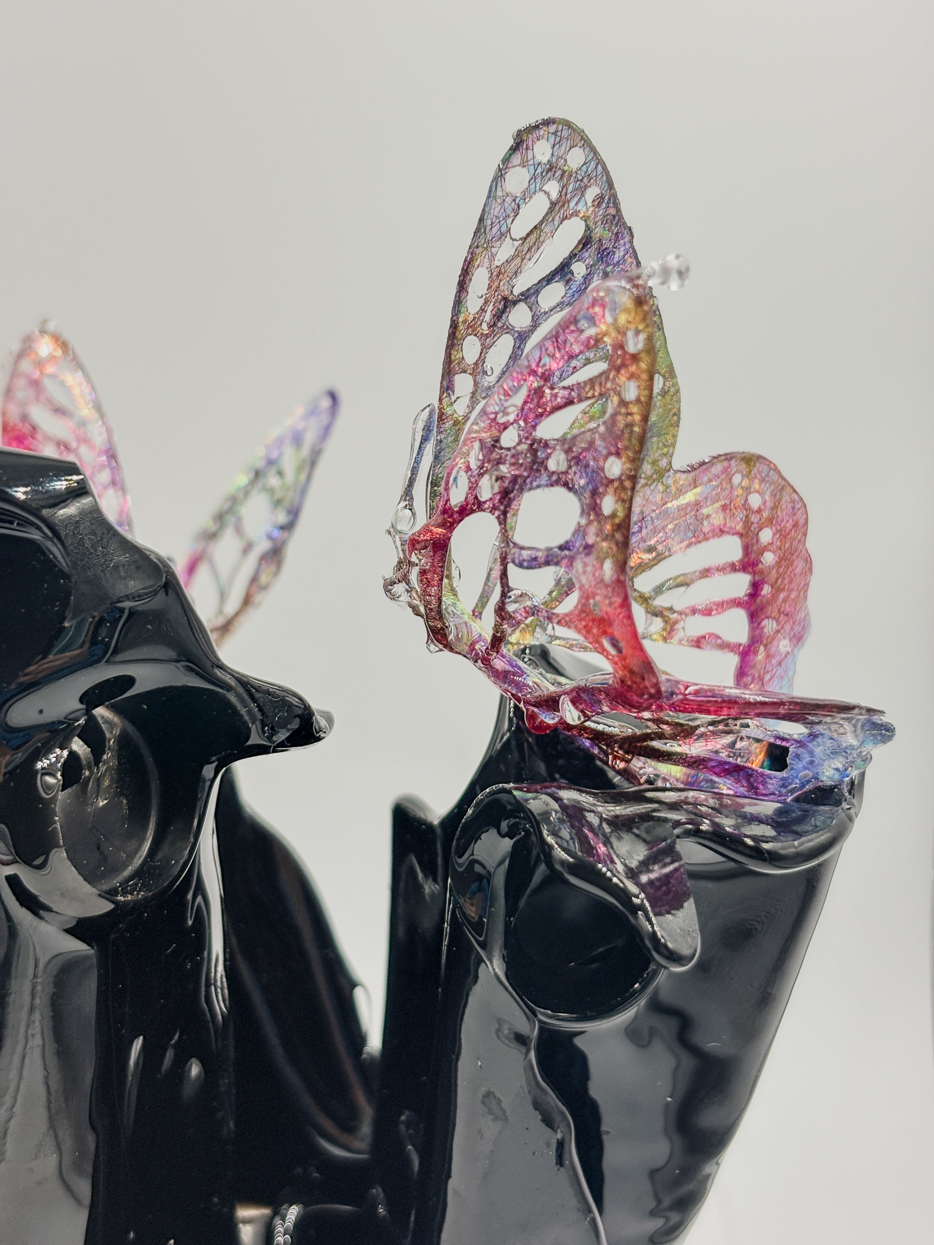 Black resin sculpture vase with butterflies